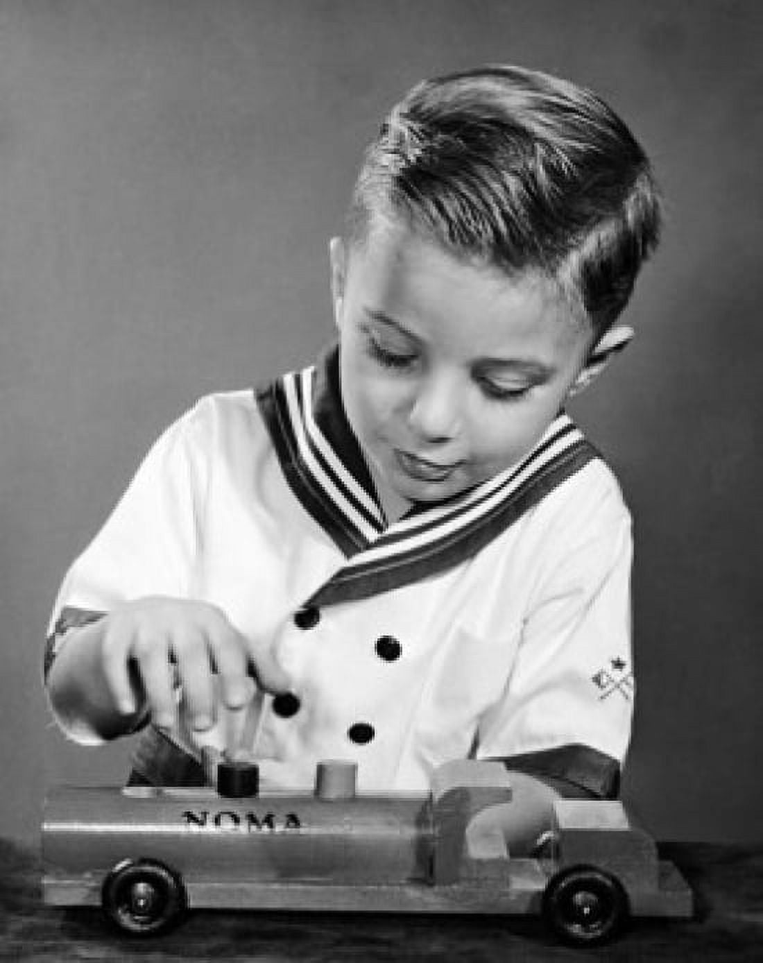 Boy playing with a toy truck Canvas Art - (24 x 36)