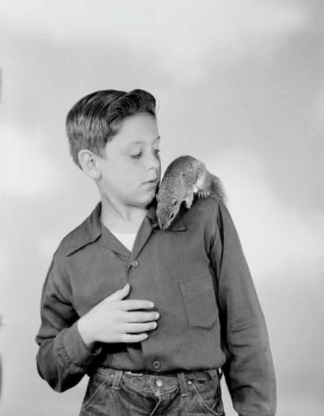 Boy playing with tamed squirrel Canvas Art - (24 x 36)
