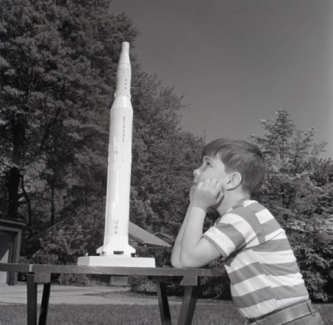 Boy playing with toy rocket Canvas Art - (18 x 24)