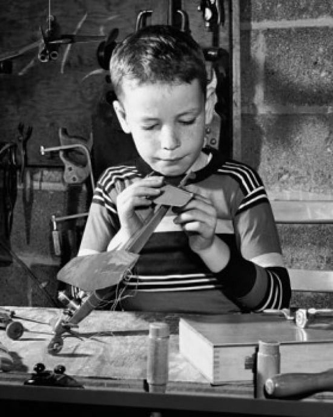 Boy repairing a model airplane Canvas Art - (18 x 24)