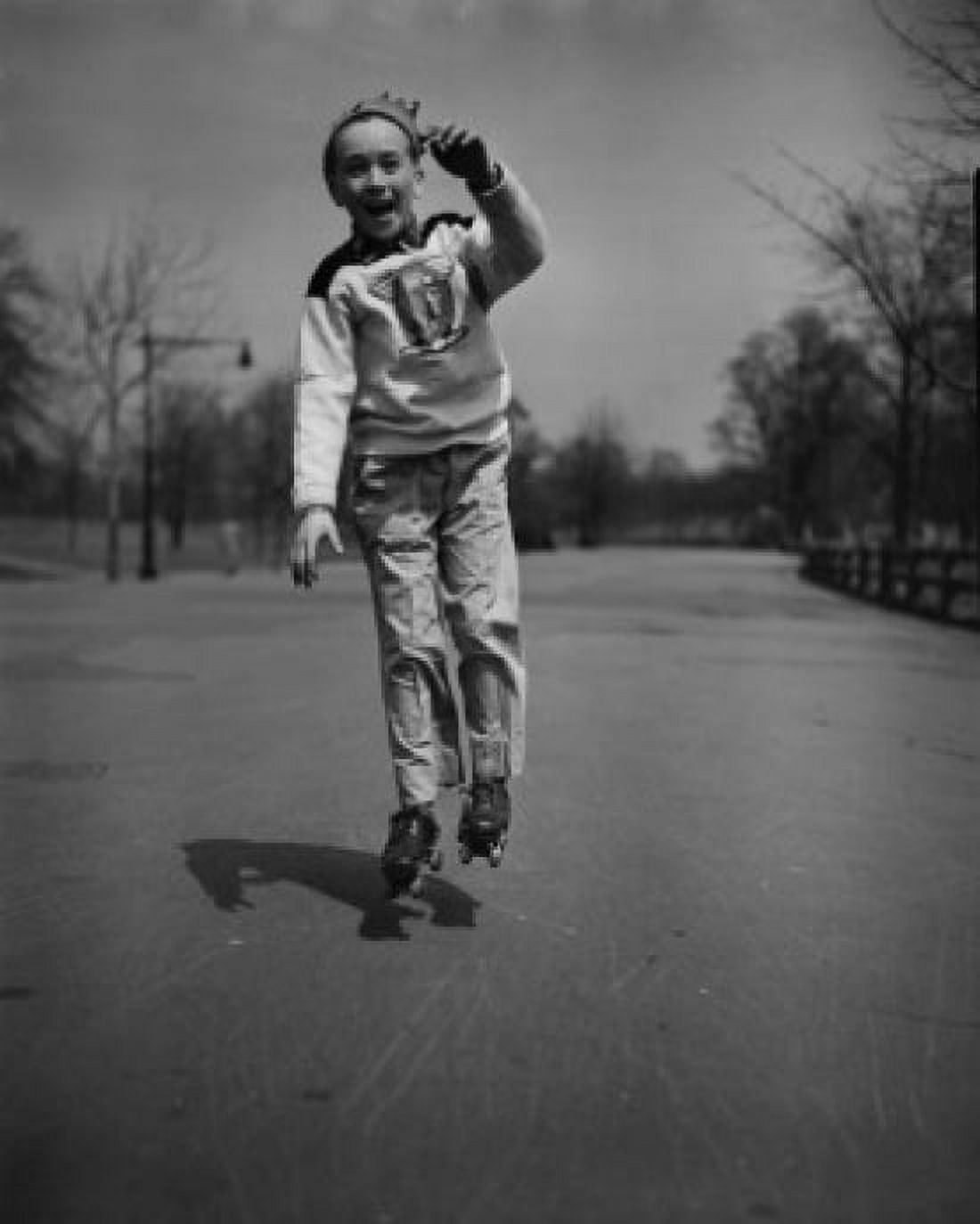 Boy roller skating in park Canvas Art - (18 x 24)