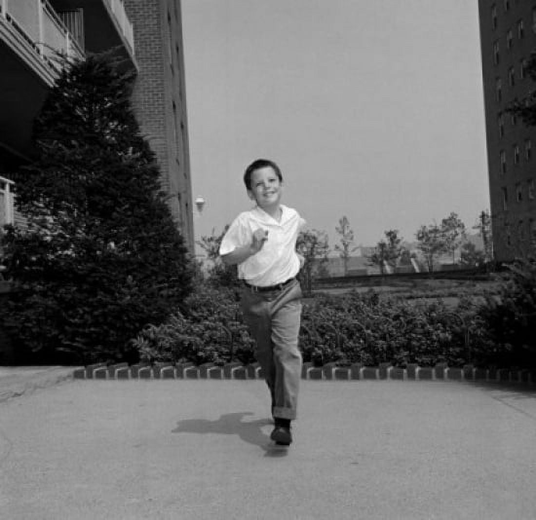 Boy running outdoors Canvas Art - (18 x 24)