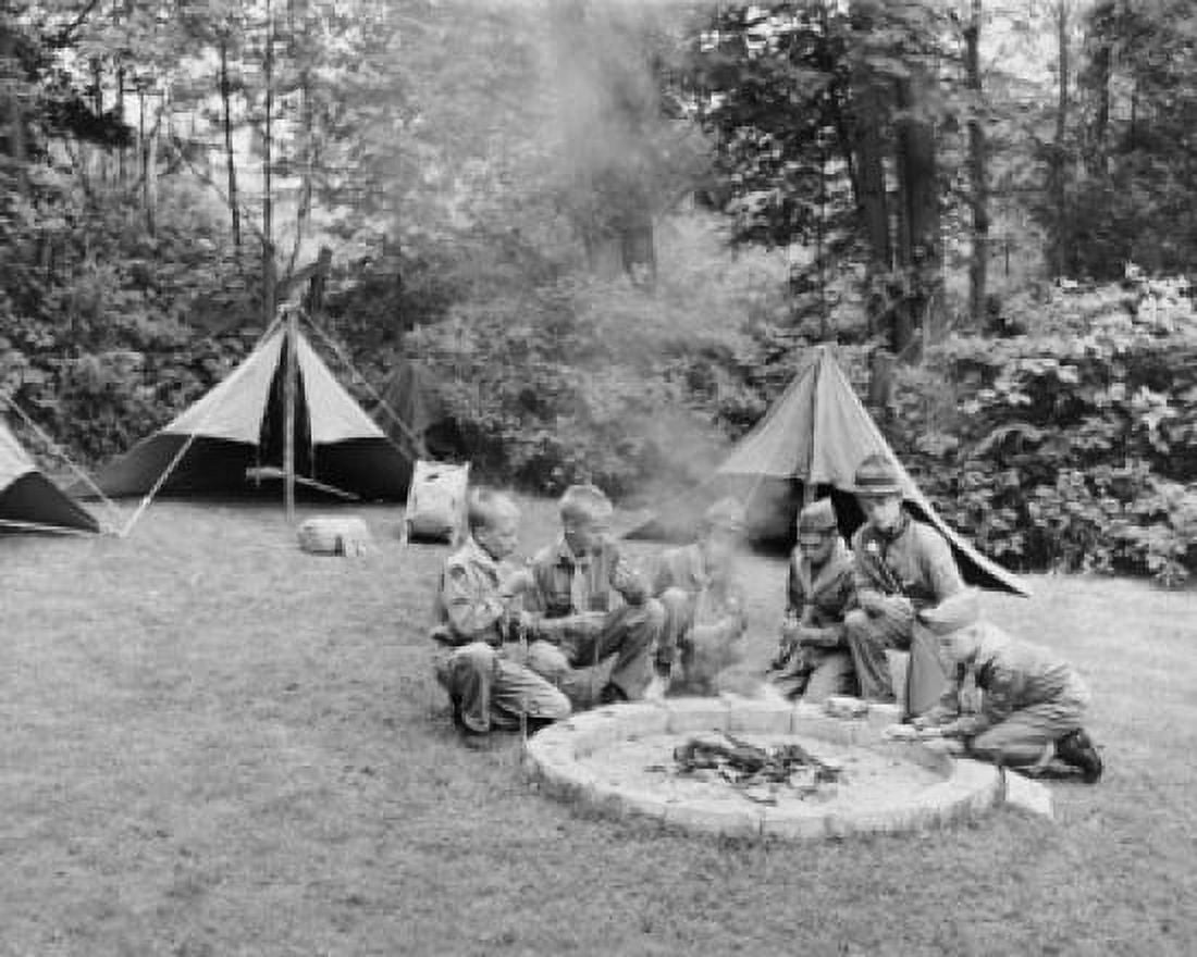 Boy scouts roasting marshmallows over a camp fire Canvas Art - (18 x 24)