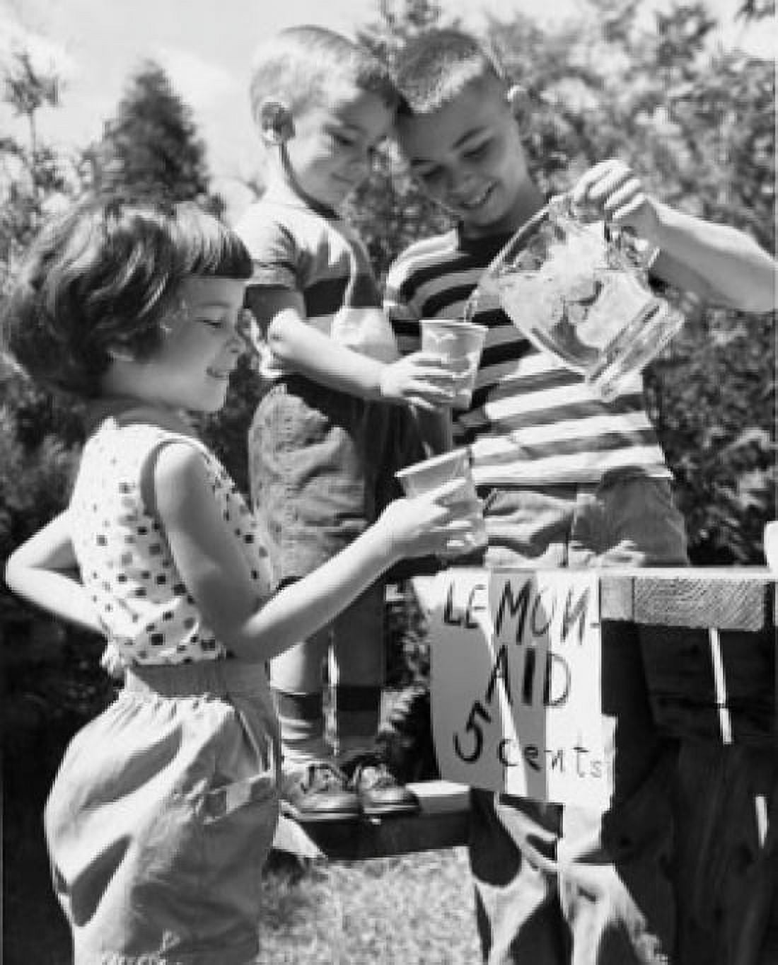 Boy serving lemonade to friends Canvas Art - (24 x 36)
