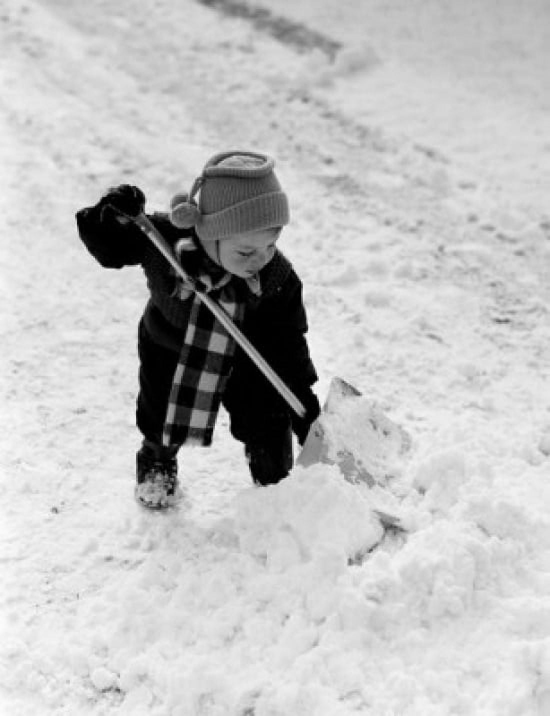 Boy shoveling snow Canvas Art - (18 x 24)