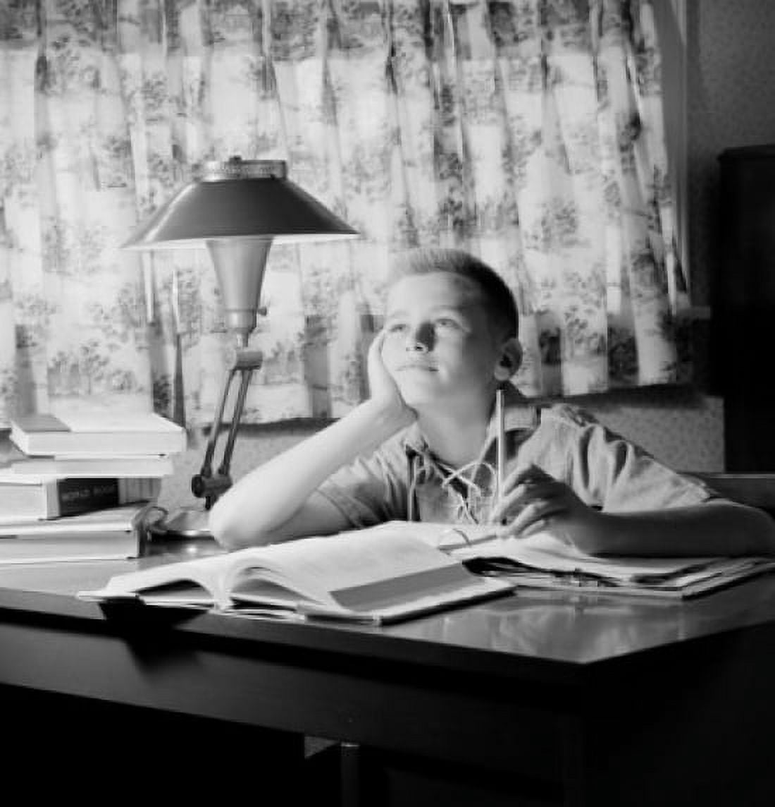 Boy sitting at desk and dreaming Canvas Art - (24 x 36)