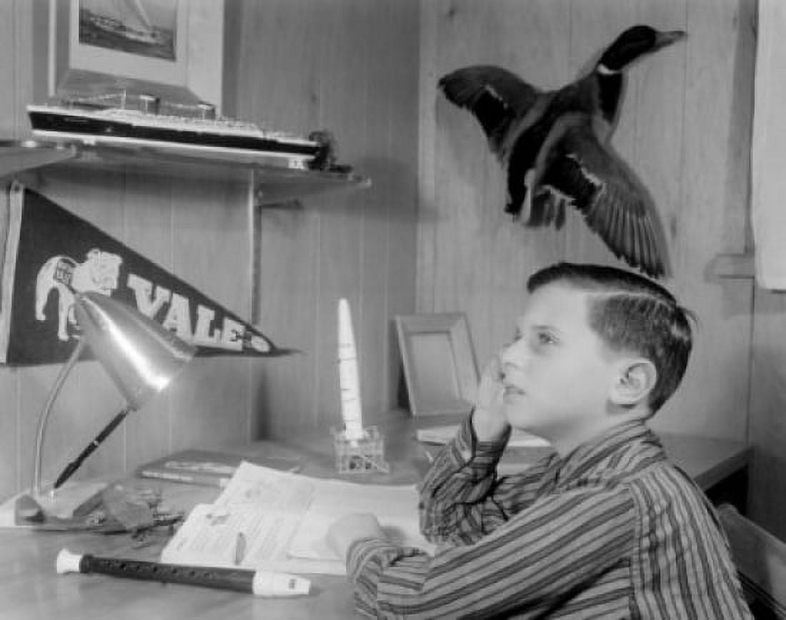 Boy sitting at desk daydreaming Canvas Art - (24 x 36)