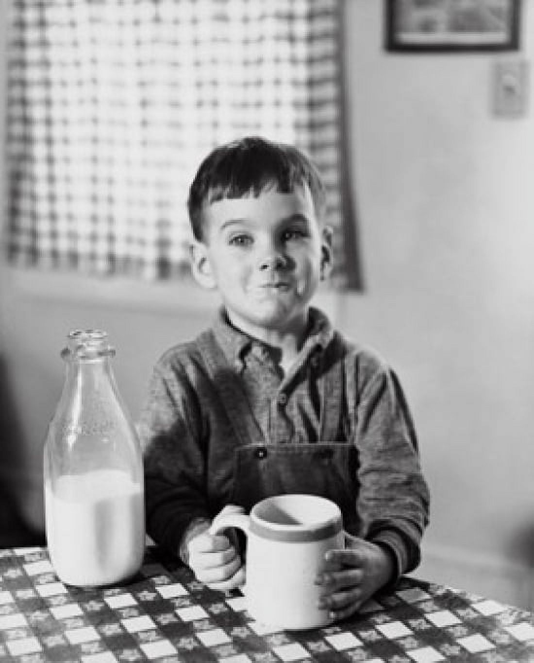 Boy sitting at the table and drinking milk Canvas Art - (18 x 24)
