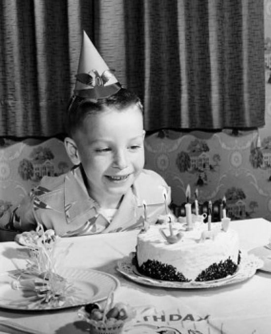 Boy sitting in front of a birthday cake Canvas Art - (24 x 36)