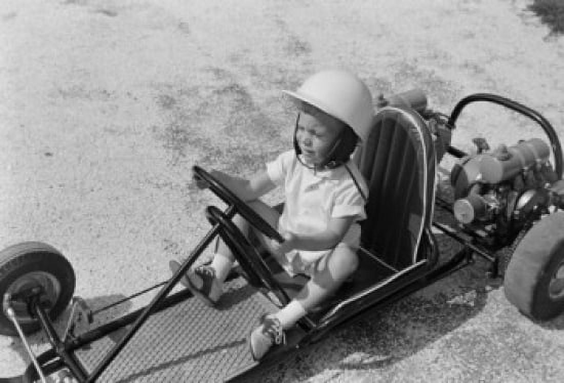 Boy sitting in gocart Canvas Art - (18 x 24)