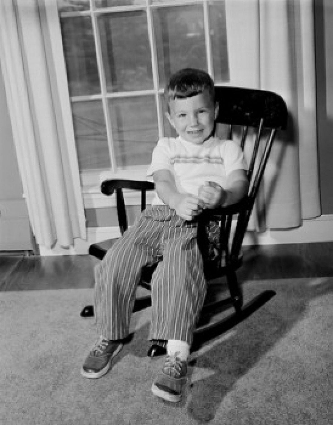 Boy sitting in rocking chair Canvas Art - (24 x 36)