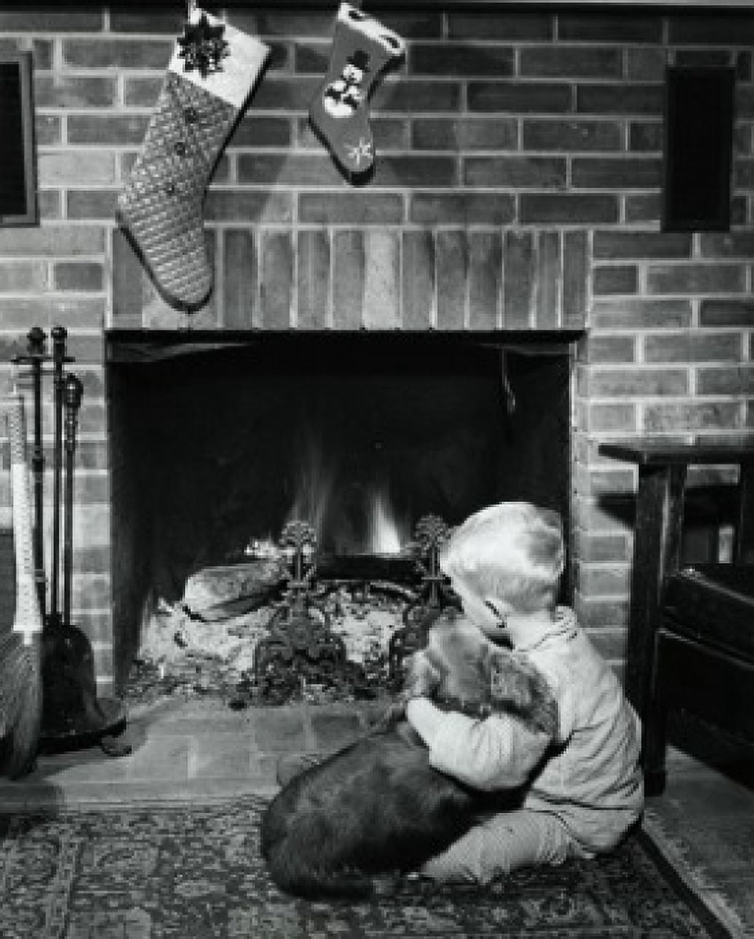 Boy sitting near fireplace with dog Canvas Art - (18 x 24)
