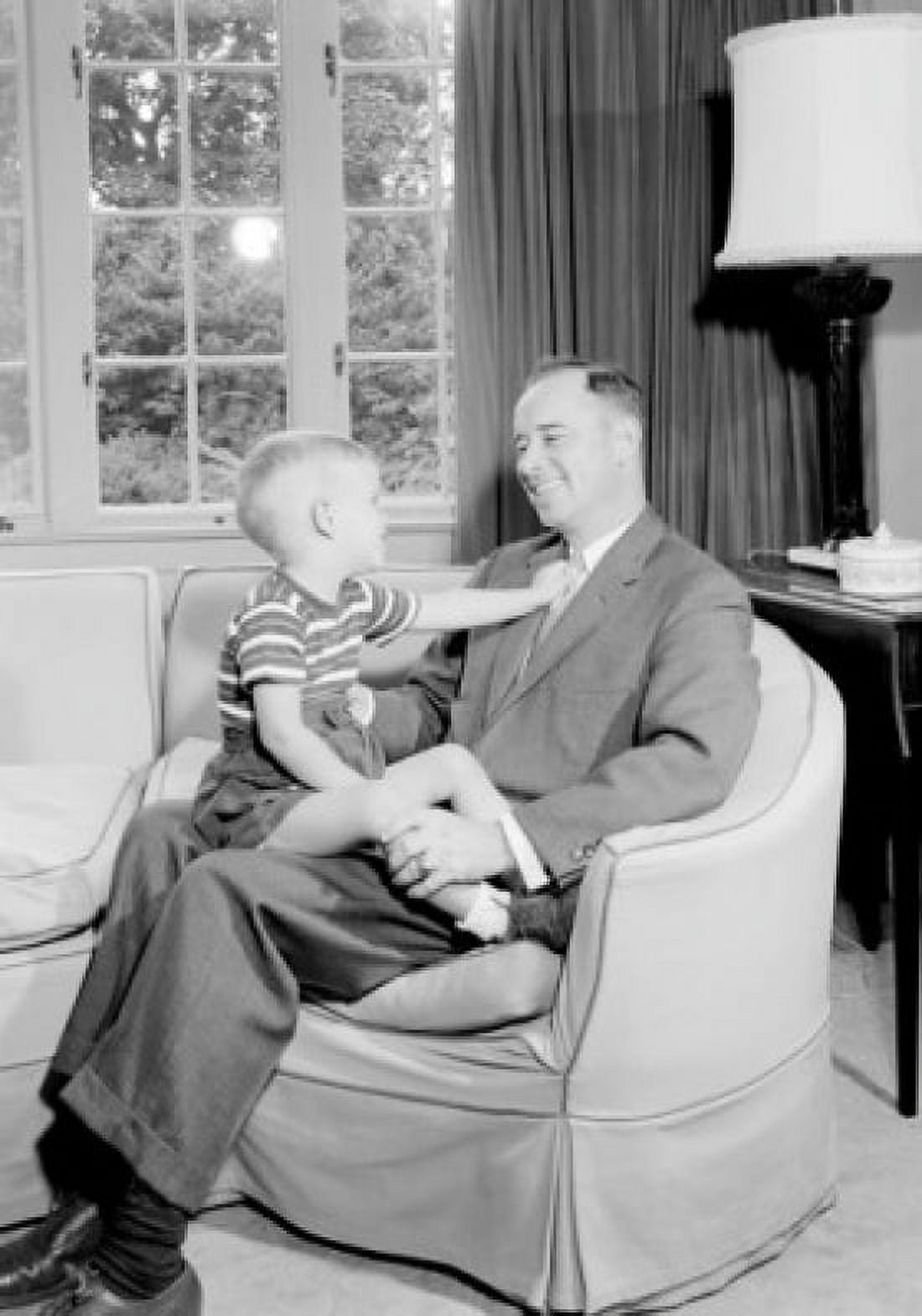 Boy sitting on fathers lap Canvas Art - (24 x 36)