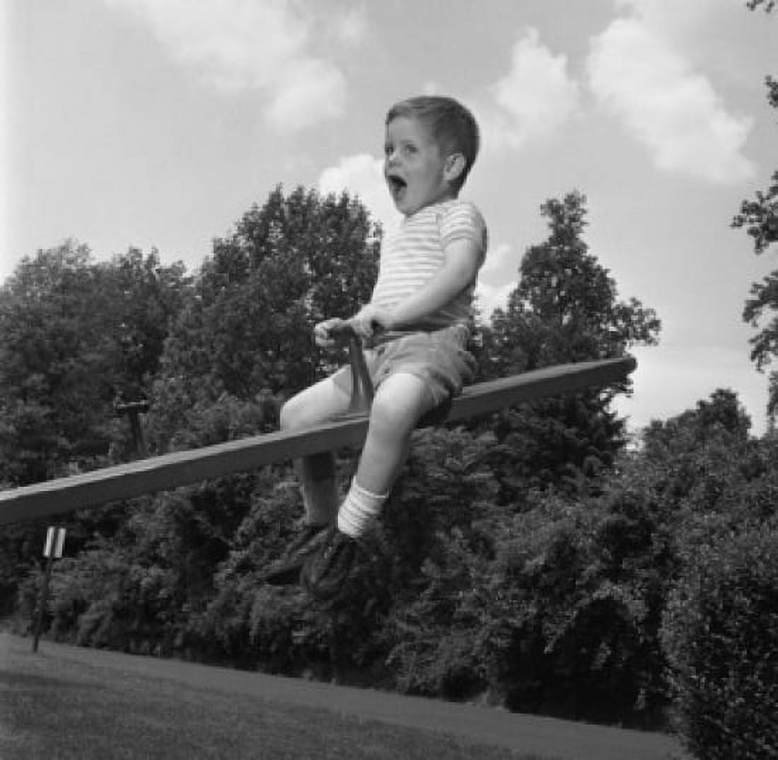 Boy sitting on seesaw and shouting Canvas Art - (18 x 24)