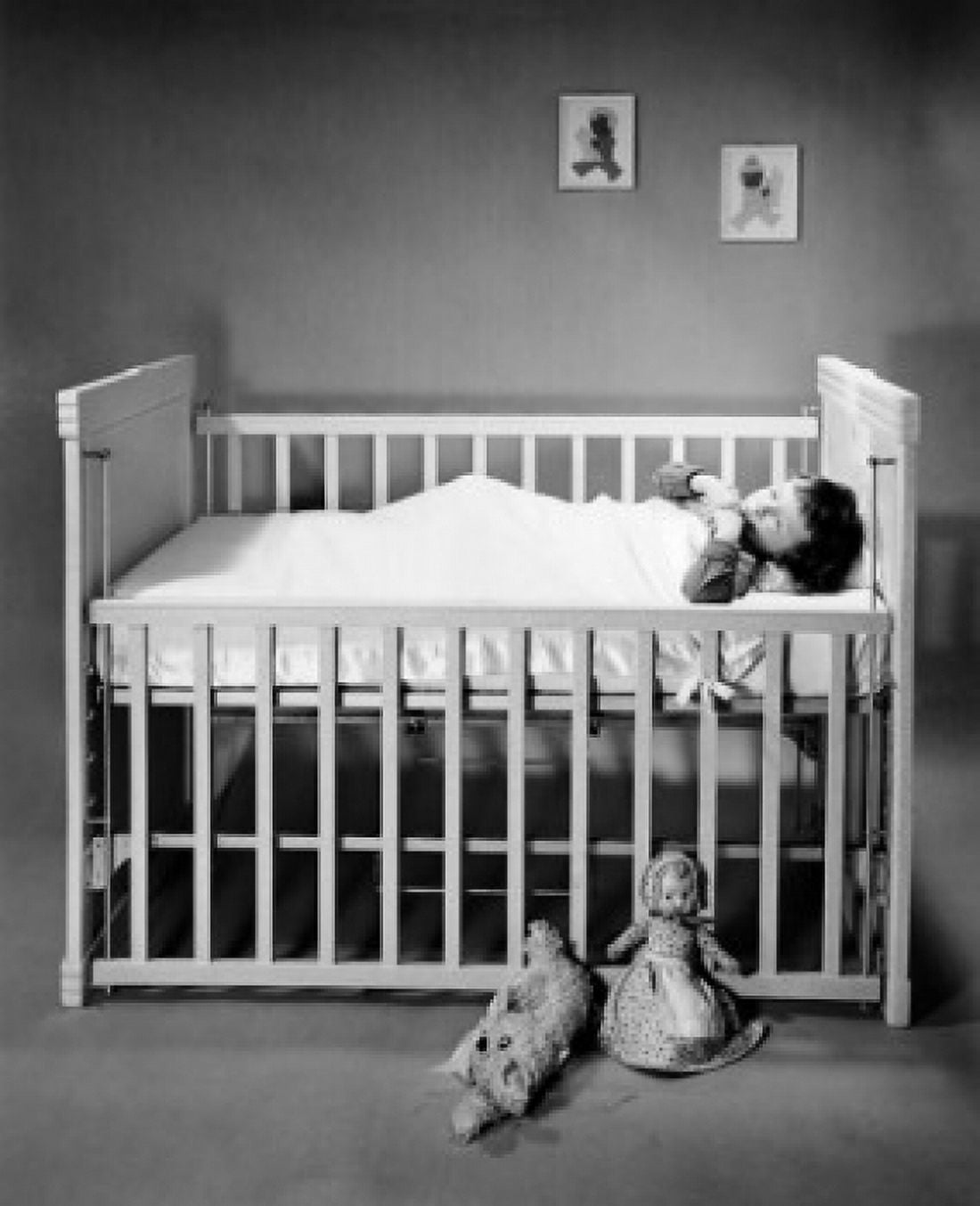 Boy sleeping in crib Canvas Art - (18 x 24)
