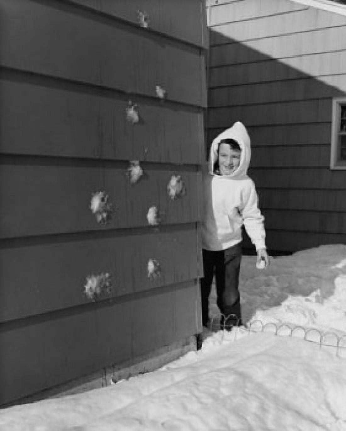 Boy standing behind a wall Canvas Art - (18 x 24)