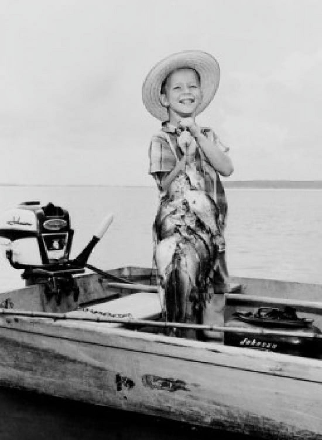 Boy standing in outboard with fine string of bass and perch Canvas Art -  (18 x 24)