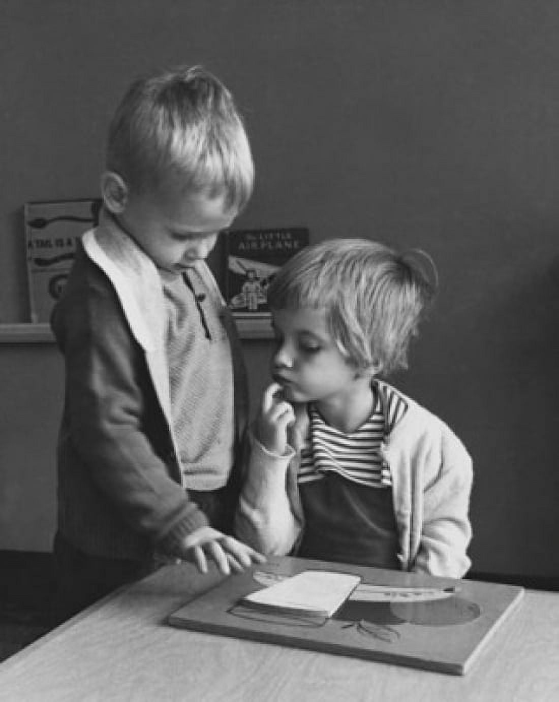 Boy standing near a girl and looking at a picture Canvas Art - (24 x 36)