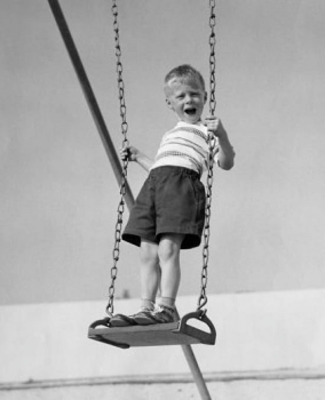 Boy standing on a swing and screaming Canvas Art - (18 x 24)