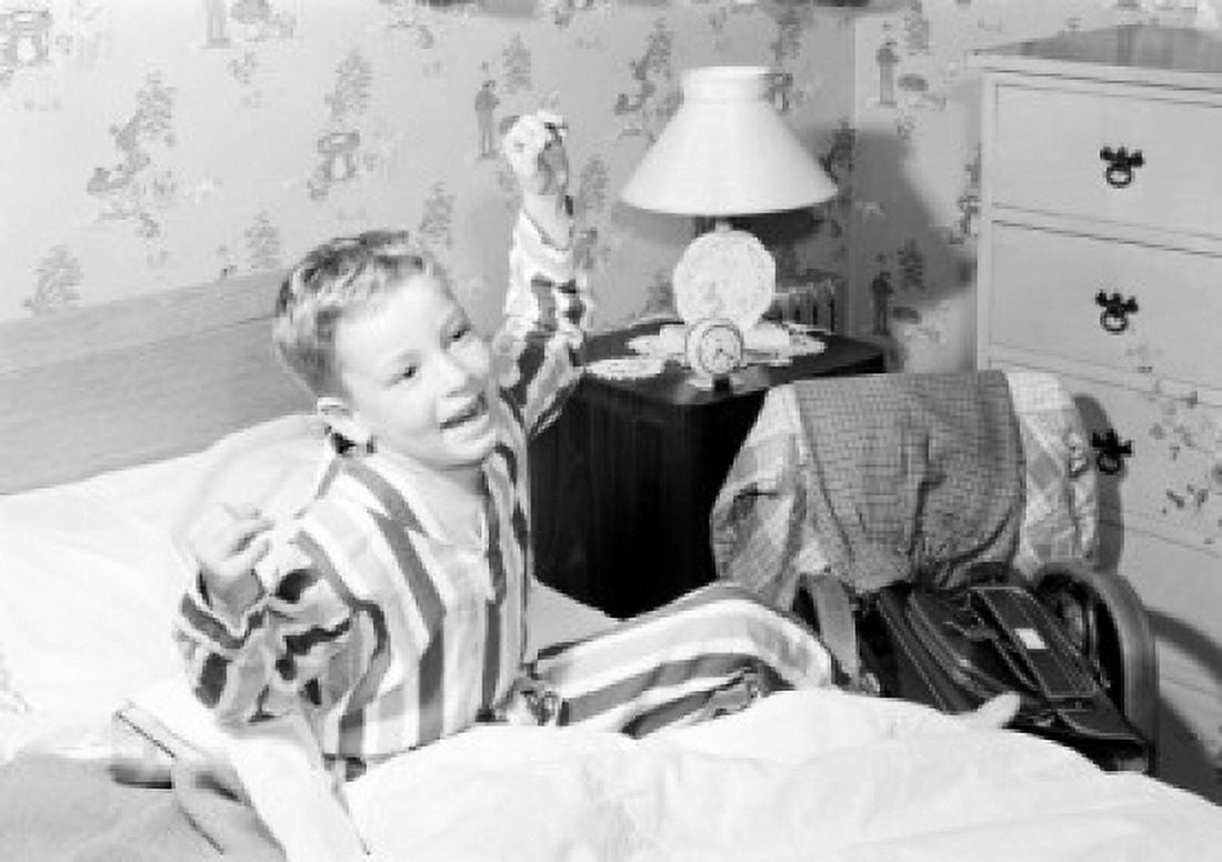 Boy stretching in bed Canvas Art - (24 x 36)