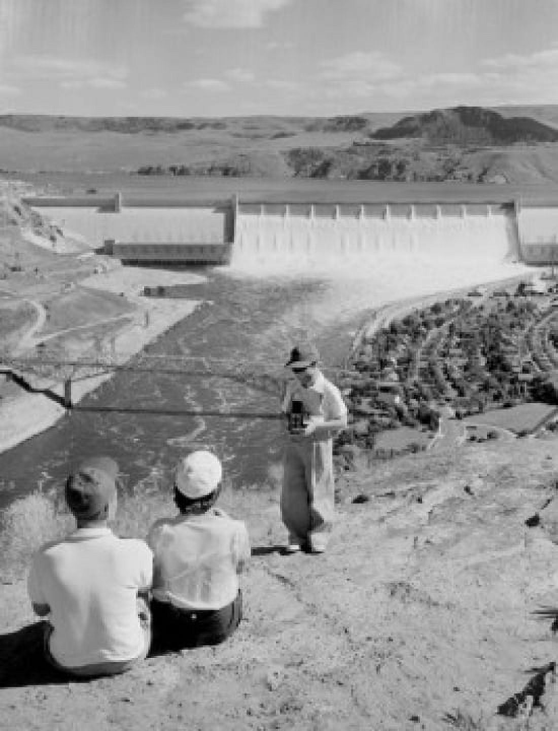 Boy taking photo of parents dam in the background Canvas Art - (18 x 24)