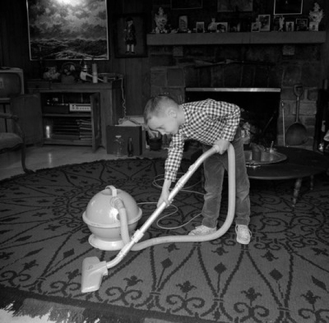 Boy vacuuming Canvas Art -  (24 x 36)
