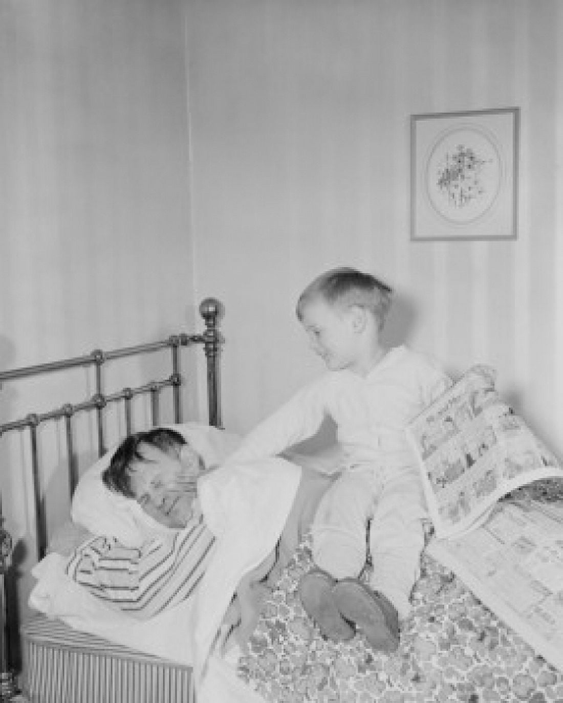 Boy waking father in bedroom Canvas Art - (24 x 36)