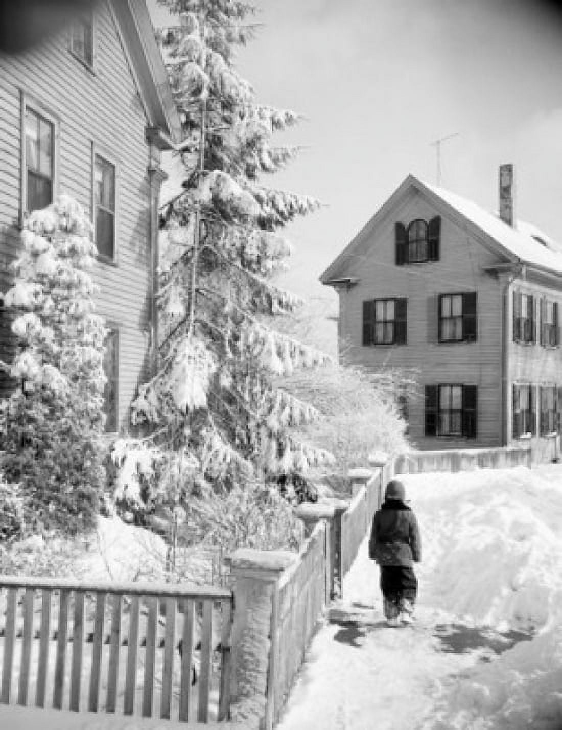 Boy walking down snowy street Canvas Art - (18 x 24)