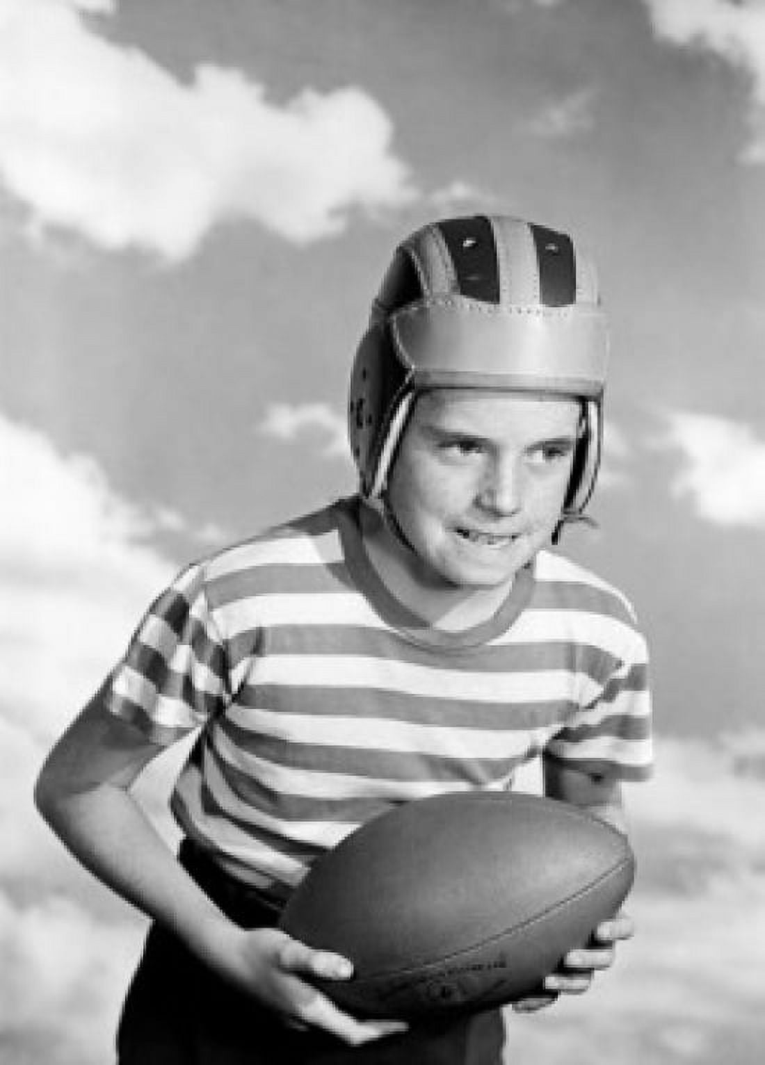 Boy wearing baseball helmet and holding baseball Canvas Art - (24 x 36)