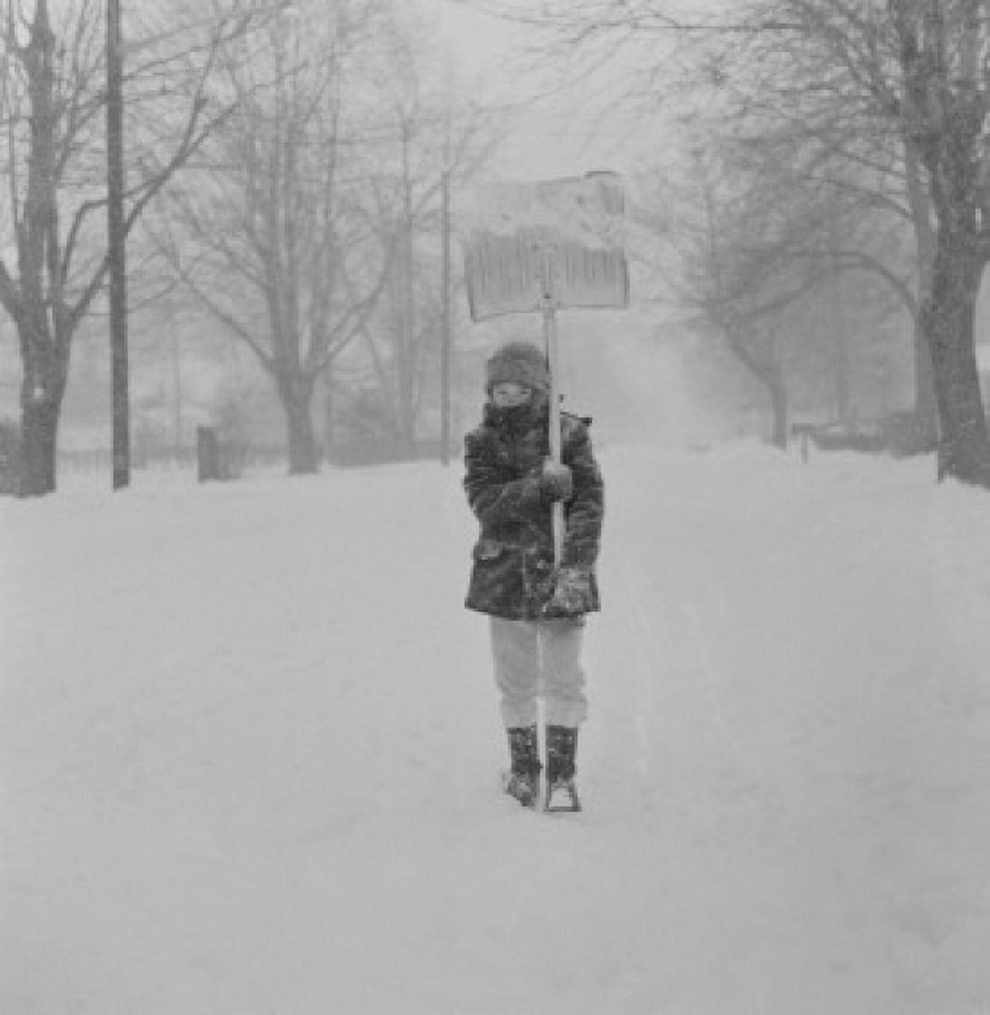 Boy with snow shovel in blizzard Canvas Art - (18 x 24)