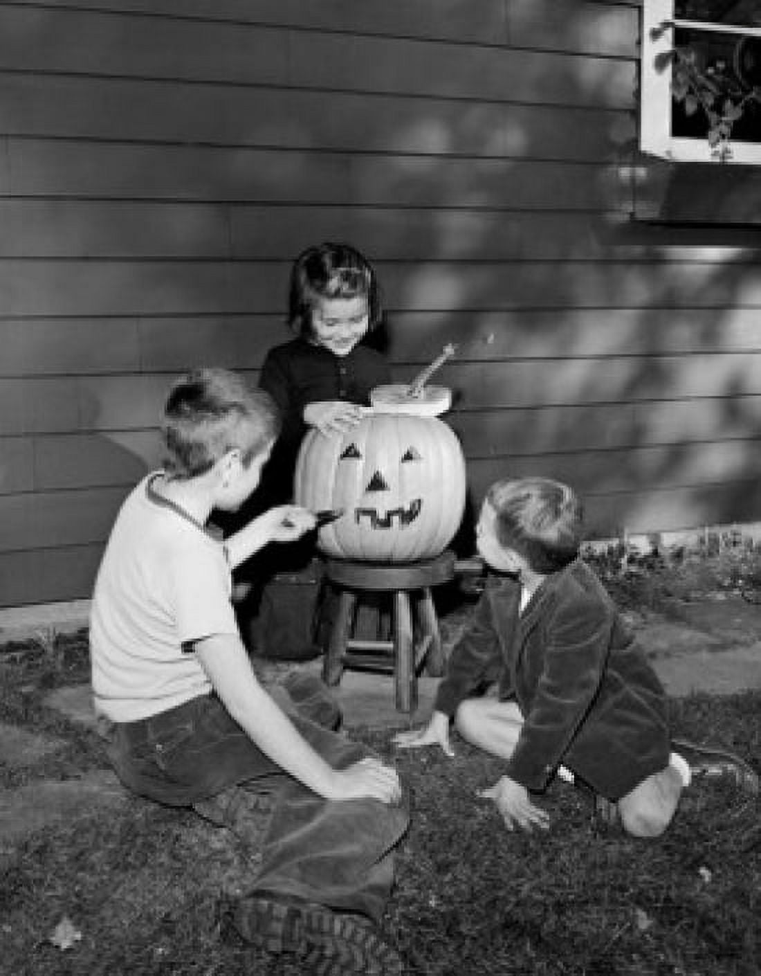 Boys and girl preparing pumpkin for Halloween party Canvas Art - (18 x 24)