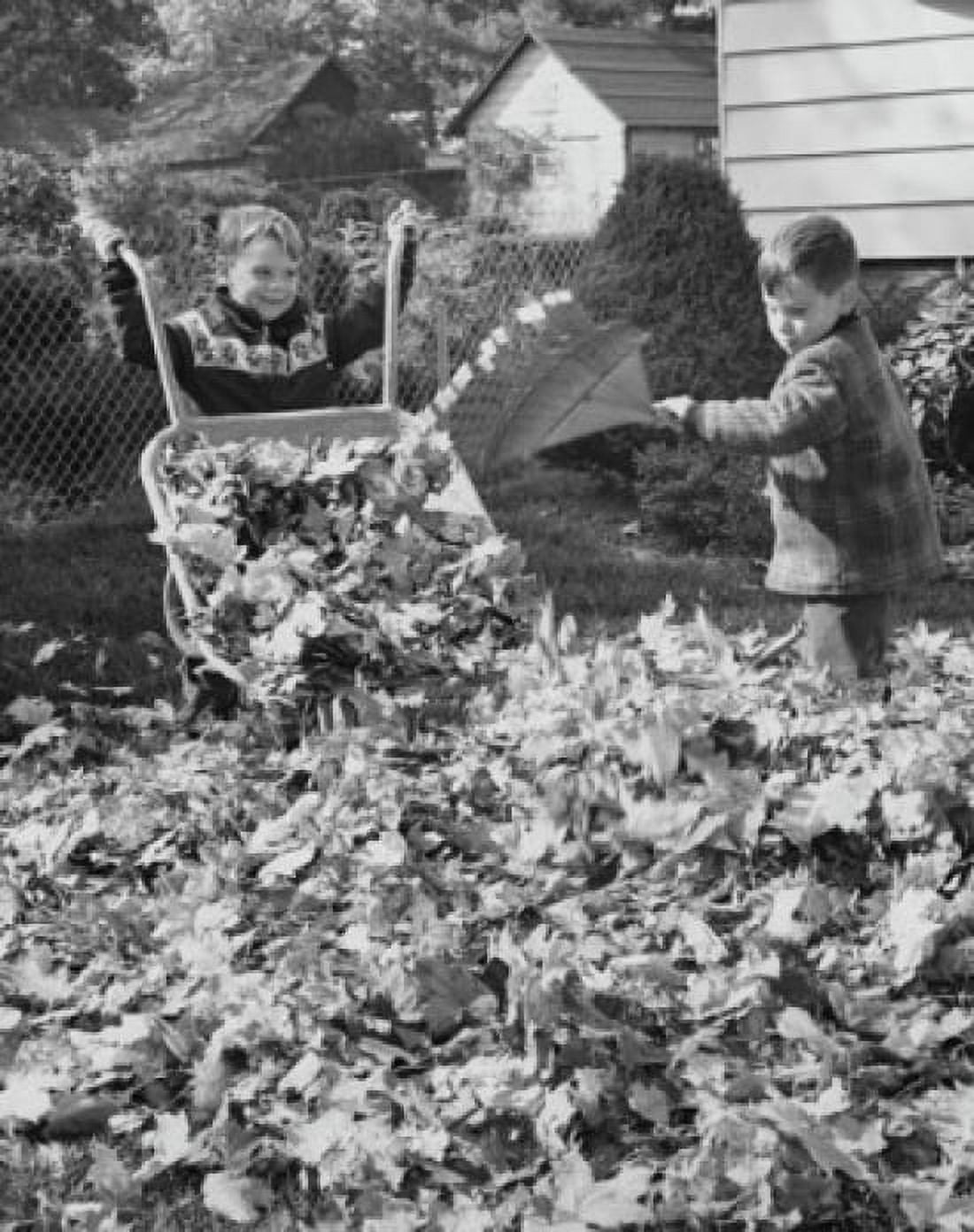 Boys cleaning leaves from garden Canvas Art - (24 x 36)