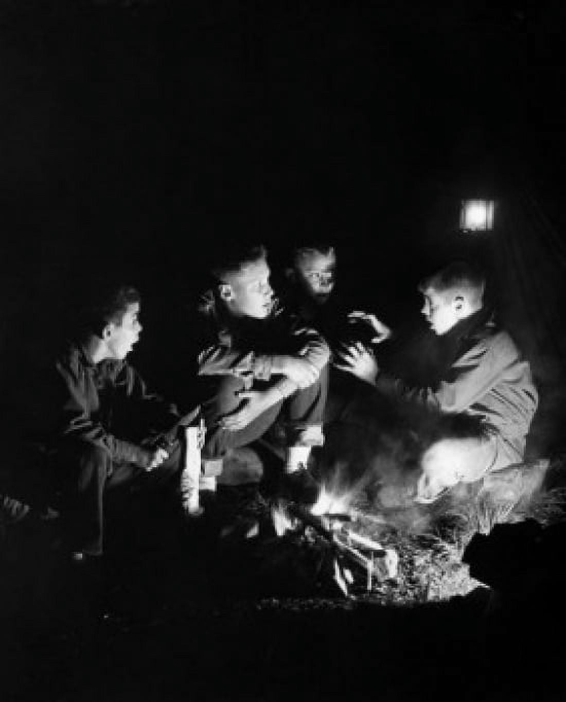 Boys listening to friend telling stories by campfire Canvas Art - (18 x 24)