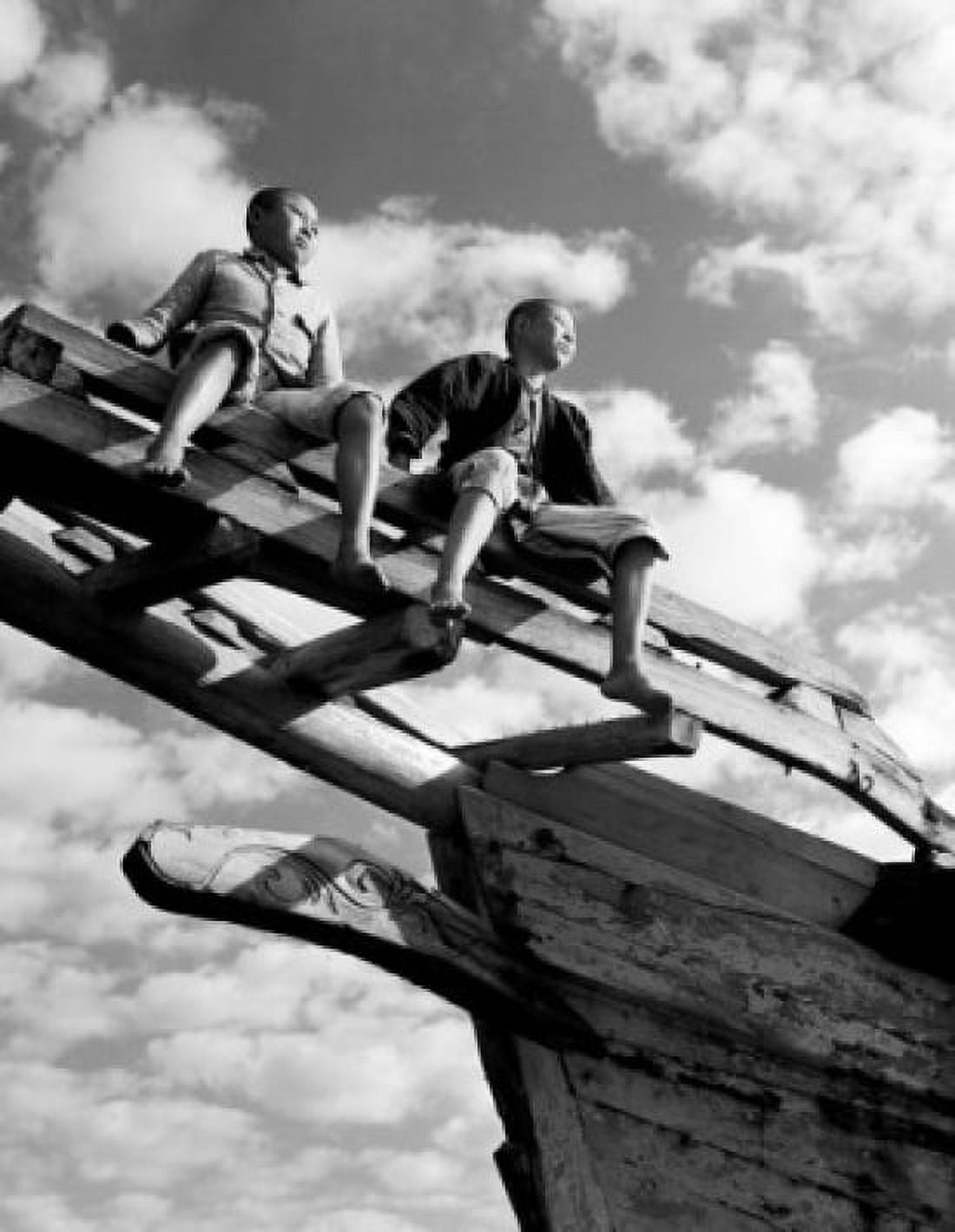 Boys sitting on top of boat Canvas Art - (18 x 24)