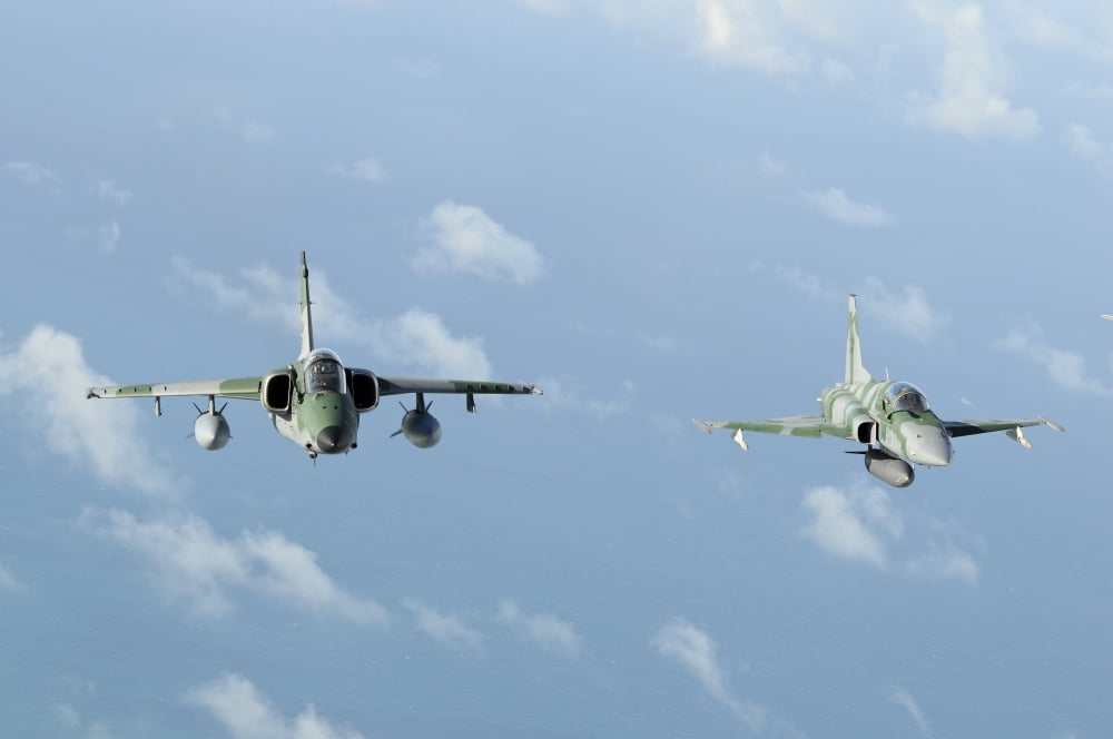 Brazilian Air Force A-1M (left) and F-5EM taken in-flight during Exercise Cruzex Canvas Art - Riccardo NiccoliStocktrek Images (34 x 23)