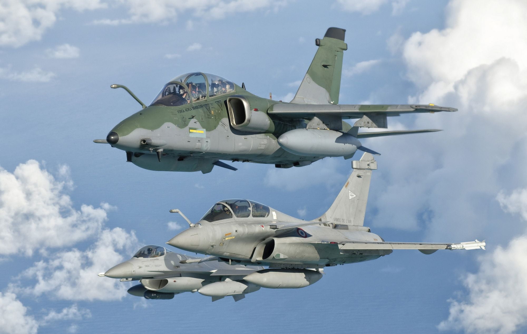 A Brazilian Air Force Embraer A-1B French Air Force Rafale and a US Air Force F-16C Fighting Falcon Canvas Art - Giovanni CollaStocktrek Images (18 x 12)