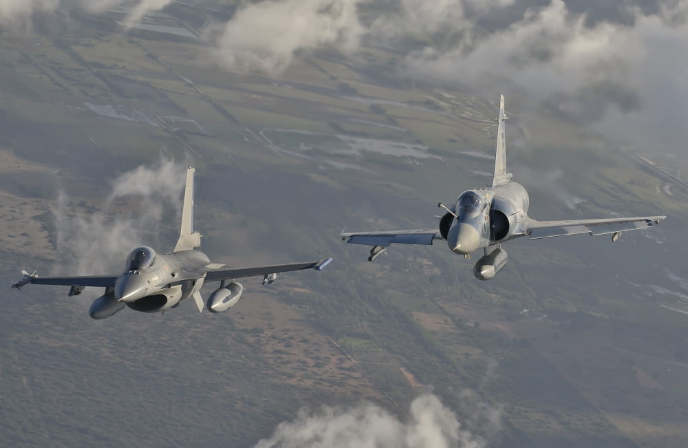 Brazilian Air Force Mirage 2000 and Chilean Air Force F-16 in flight over Brazil Canvas Art - Giovanni CollaStocktrek Images (35 x 23)