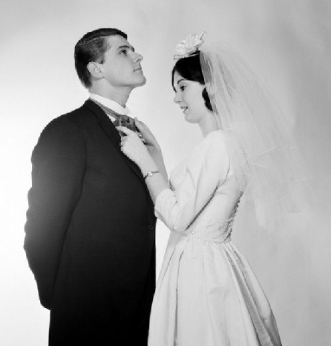 Bride adjusting grooms bow tie Canvas Art -  (24 x 36)