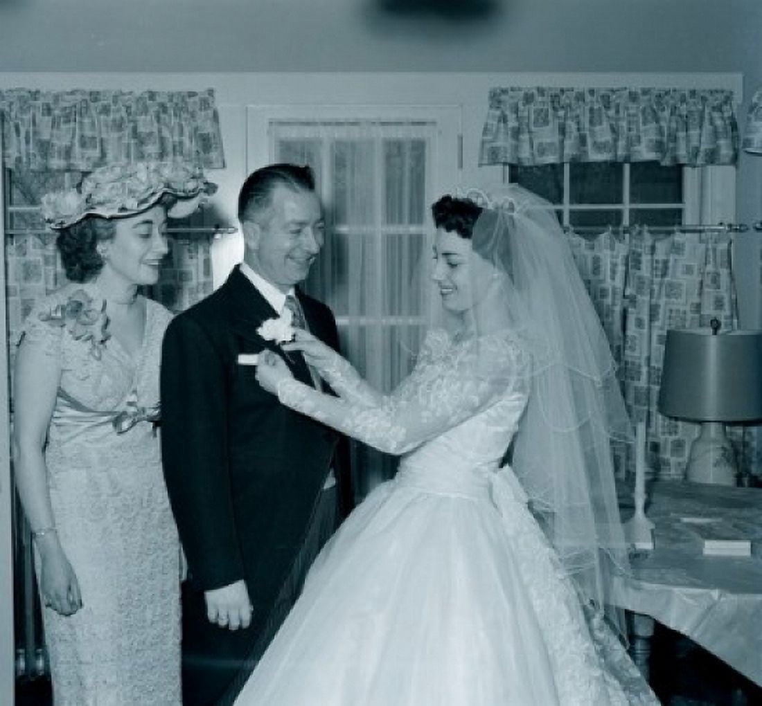 Bride attaching flower to fathers boutonniere Canvas Art - (18 x 24)