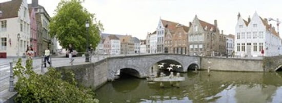 Bridge across a channel Bruges West Flanders Belgium Canvas Art - Panoramic Images (36 x 13)
