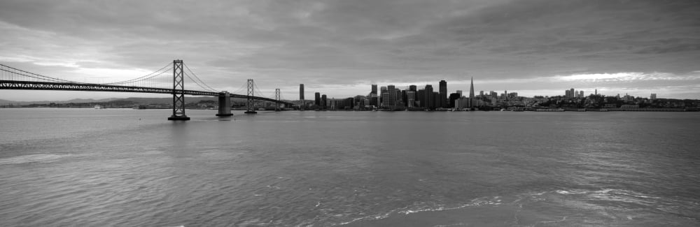 Bridge across a bay with city skyline in the background Bay Bridge San Francisco Bay San Francisco California USA Canvas Art - Panoramic Images (12 x 36)