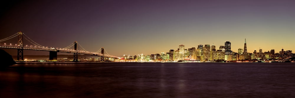 Bridge across a bay with city skyline in the background Bay Bridge San Francisco Bay San Francisco California USA Canvas Art - Panoramic Images (6 x 18)