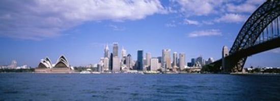 Bridge across the bay with skyscrapers in the background Sydney Harbor Bridge Sydney New South Wales Australia Canvas Art - Panoramic Images (36 x 13)