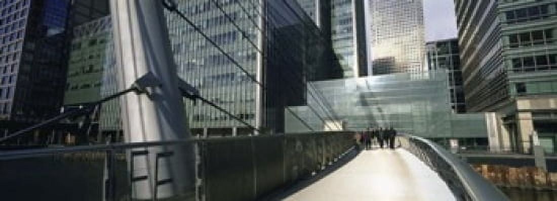 Bridge in front of buildings Canary Wharf London England Canvas Art - Panoramic Images (18 x 7)