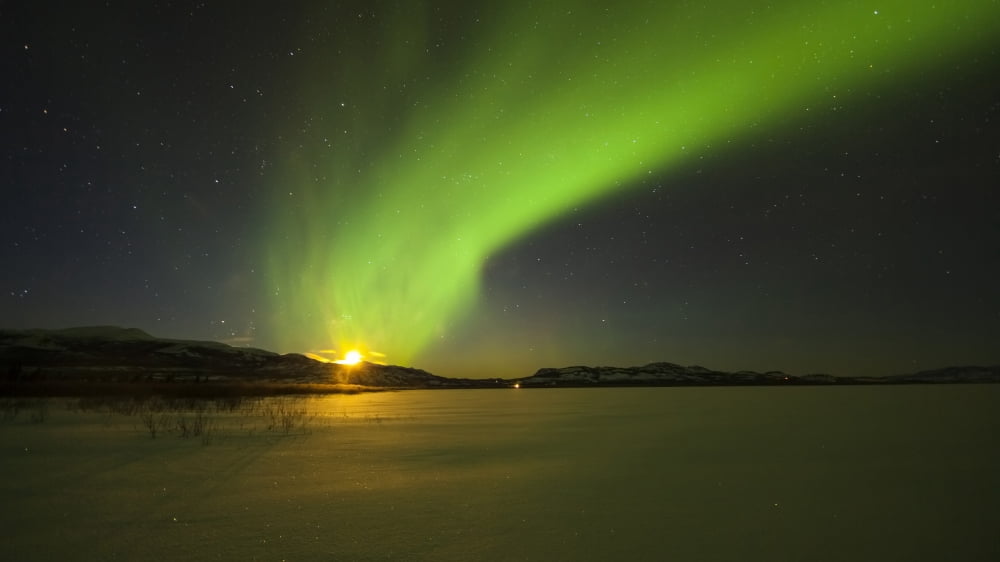 Bright aurora borealis over Lake Laberge Yukon Canada Canvas Art - Philip HartStocktrek Images (19 x 11)