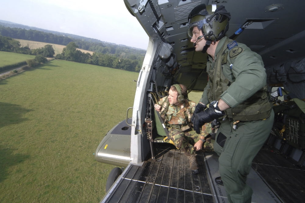 British Army soldiers look out of a Merlin helicopter of the Royal Air Force Canvas Art - Andrew ChittockStocktrek Images (34 x 23)