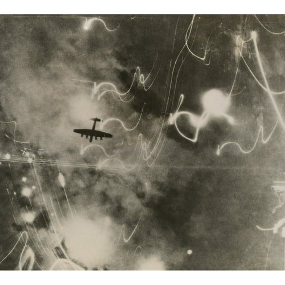 British Raf Bomber And Trails Of Light From Incendiary Bombs. Photo Taken Of The Bombing Of The Shipbuilding Yards In