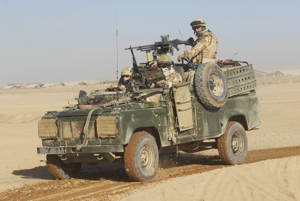 British soldiers patrol Afghanistan in a Land Rover Canvas Art - Andrew ChittockStocktrek Images (34 x 23)
