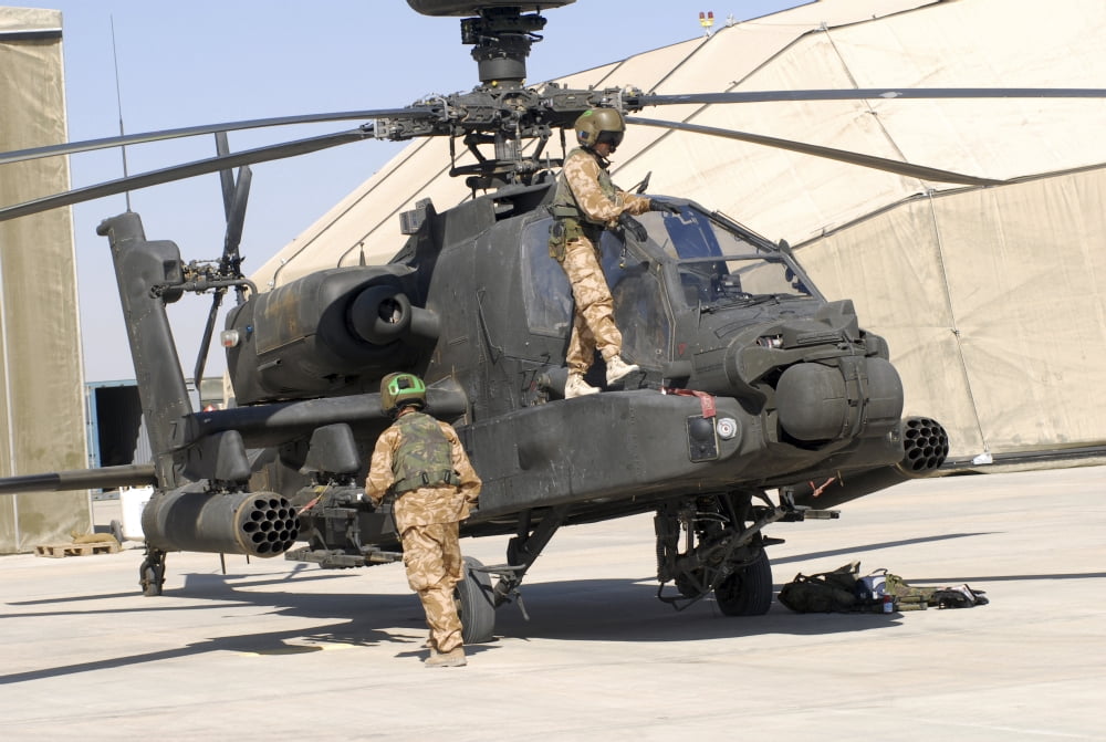 British soldiers perform maintenance on an Apache helicopter Canvas Art - Andrew ChittockStocktrek Images (34 x 23)