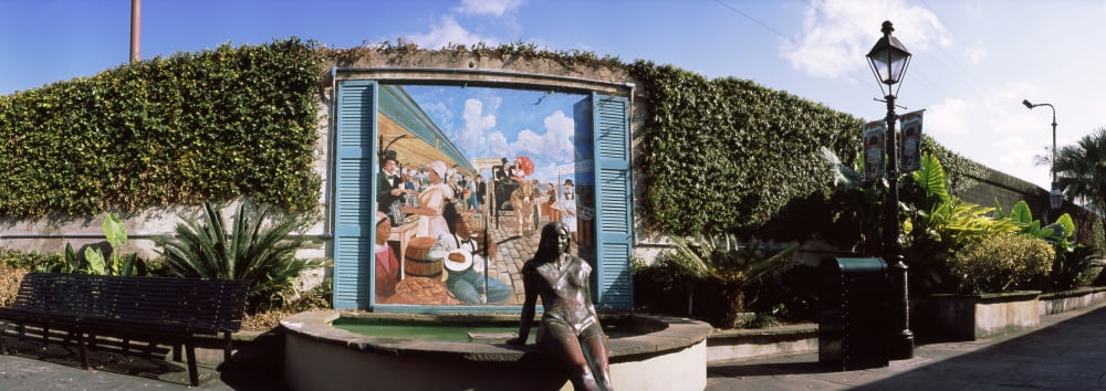 Bronze woman fountain statue in front of a mural French Quarter New Orleans Louisiana USA Canvas Art - Panoramic Images (27 x 9)